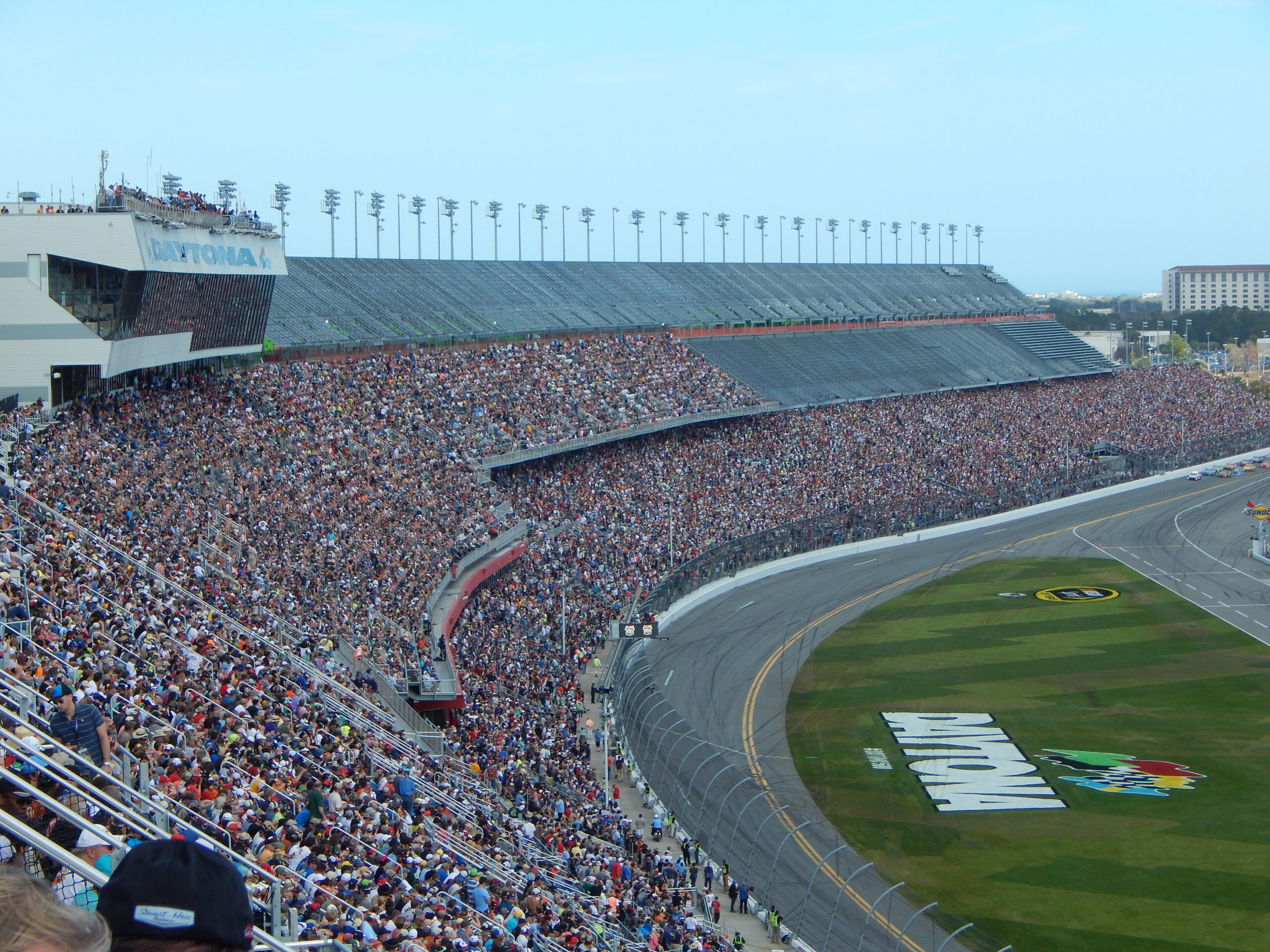Infield RVs and Daytona grandstands at sunset